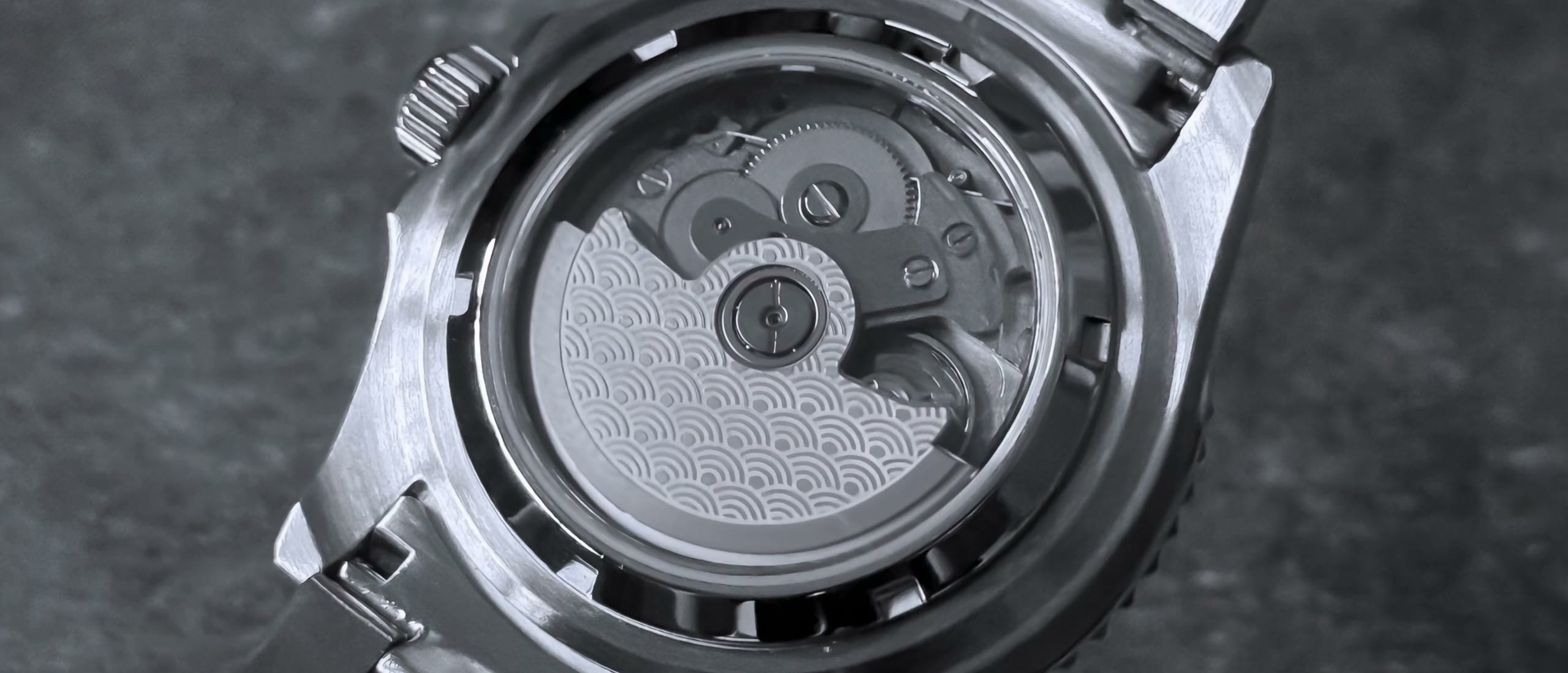 Sapphire caseback showing the Seiko automatic rotor